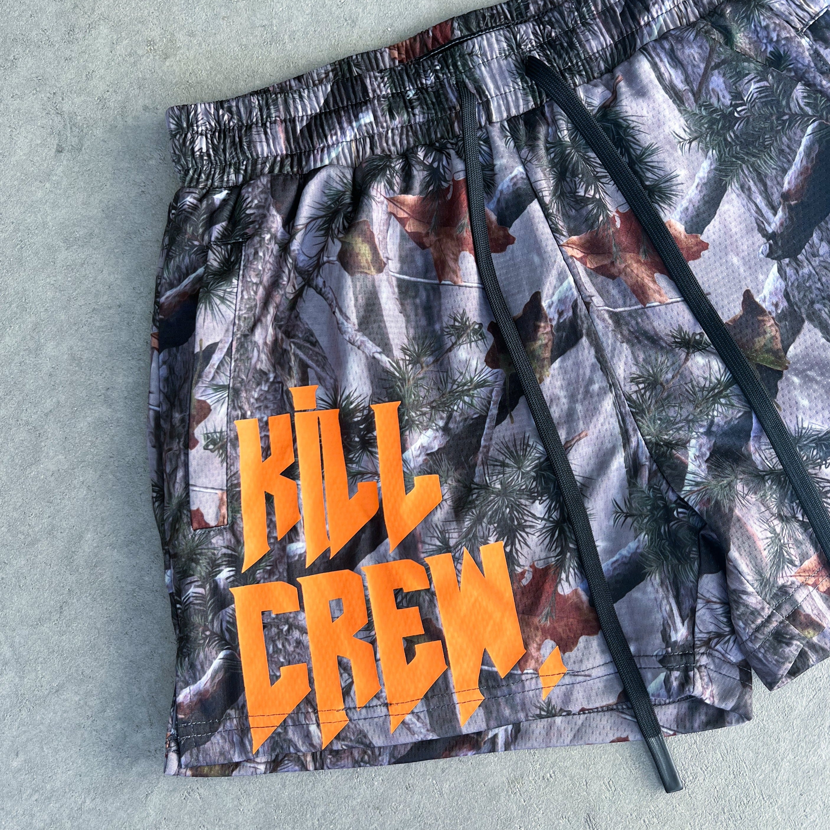 MUAY THAI SHORTS (MID THIGH CUT) - CAMO / ORANGE